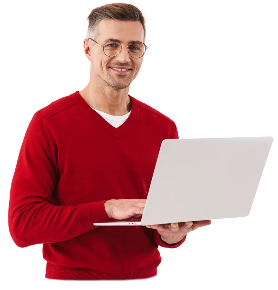 man in red holding laptop