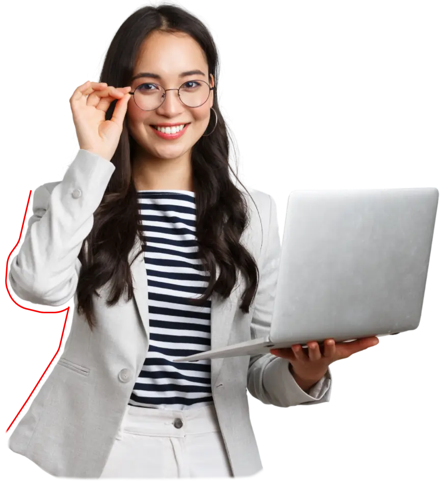 woman in white holding a laptop